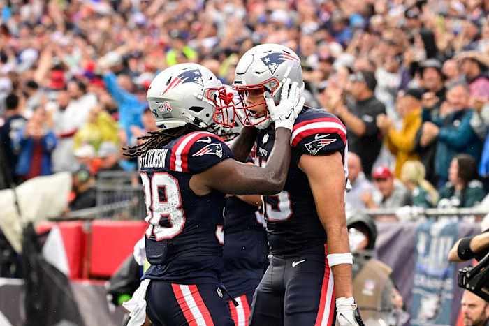 Sep 10, 2023; Foxborough, Massachusetts, USA; New England Patriots tight end Hunter Henry (right) celebrates a touchdown with running back Rhamondre Stevenson (38) during the first half against the Philadelphia Eagles at Gillette Stadium. Mandatory Credit: Eric Canha-USA TODAY Sports